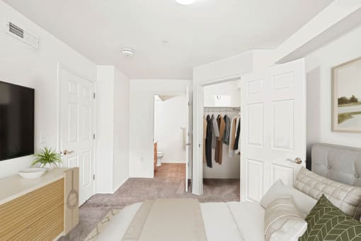 Bedroom with walk-in closet and ensuite bathroom at Rose Cove Homes Apartments, Farmington, Utah