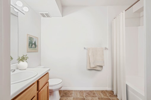 Bathroom with woodstyle flooring and tub shower combo at Rose Cove Homes Apartments, Utah, 84025