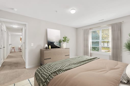 a bedroom with a bed and a dresser