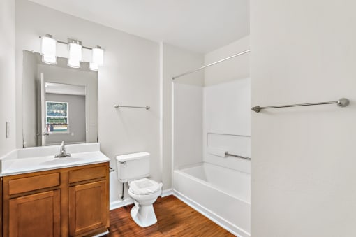 a bathroom with a toilet sink and bathtub
