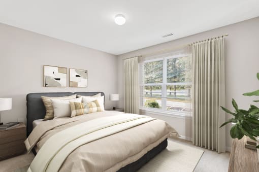 a bedroom with a large bed and two windows