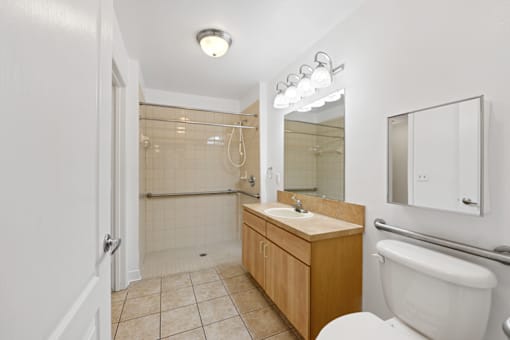 a bathroom with a toilet sink and shower