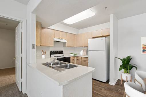 kitchen with a white counter at The Village at Sun Valley Apartments, Mesa, AZ 85207