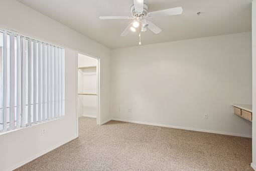 room with a ceiling fan at The Village at Sun Valley Apartments, Mesa Arizona