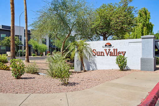 community sign at The Village at Sun Valley Apartments, Mesa, AZ