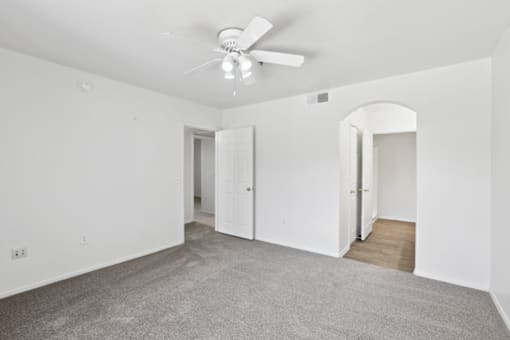 Empty room with carpeted floor at The Village at Sun Valley Apartments, Mesa, AZ 85207