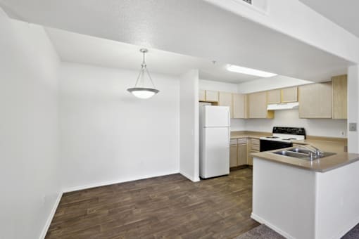 kitchen with white table at The Village at Sun Valley Apartments, Mesa, AZ