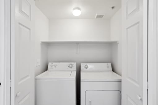 small laundry room at The Village at Sun Valley Apartments, Mesa, AZ 85207