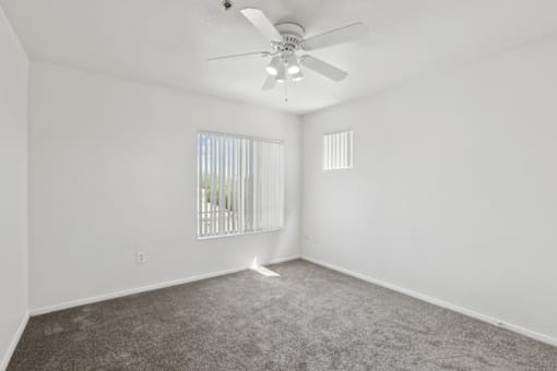 White fan in empty room at The Village at Sun Valley Apartments, Arizona