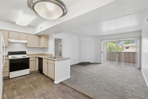 spacious kitchen with wooden flooring at The Village at Sun Valley Apartments, Arizona, 85207