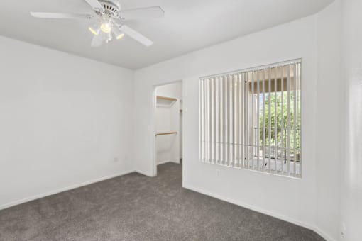 room with a ceiling fan at The Village at Sun Valley Apartments, Arizona