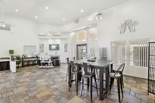 club room with a table at The Village at Sun Valley Apartments, Mesa, 85207