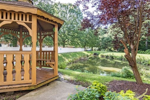 Gazebo with Waterfront View Next to Decorative Tree
