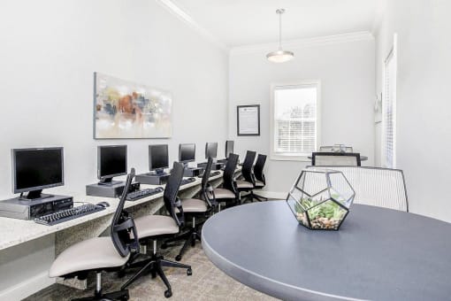 Business center with 6 computers.