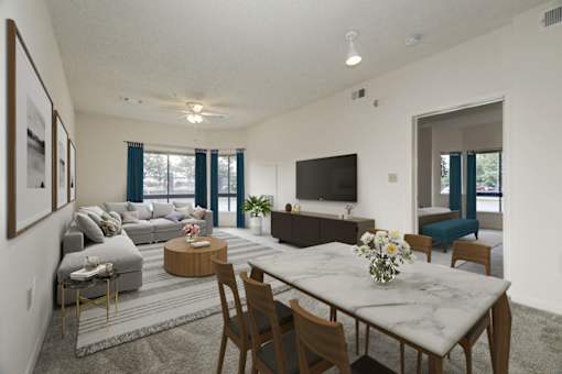 a living room with a table and chairs in front of a couch