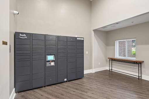 A room with a large storage unit and a bench.