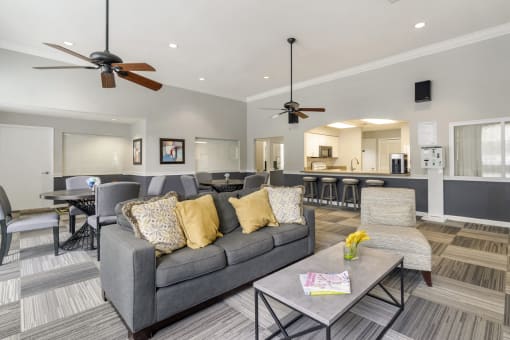 clubhouse with couch and tables and chairs behind