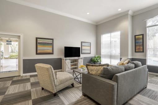 community clubhouse with a mounted tv and seating