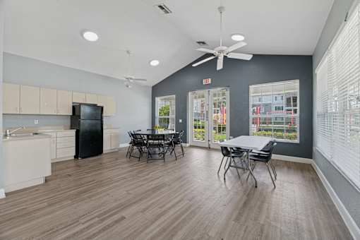 clubhouse kitchen with tables and chairs