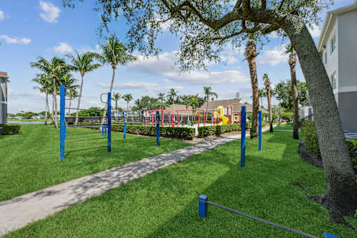 A playground with a slide and swings.