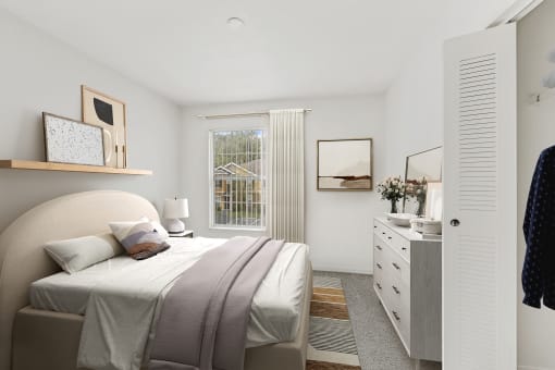 a bedroom with a bed and a dresser in a 555 waverly unit