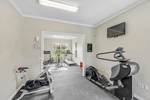 Fitness center with treadmill and weight machines