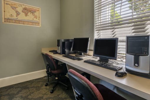 Business Center with 2 computers and chairs
