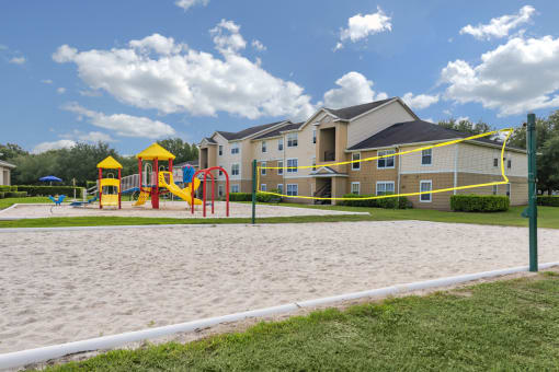 our apartments showcase a sandy volleyball court