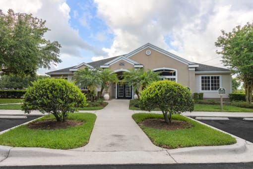 a house with palm trees in front of it