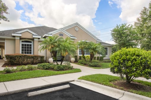a house with palm trees in front of it