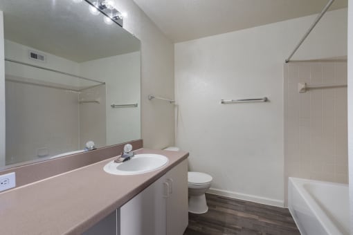 a bathroom with a sink toilet and bathtub