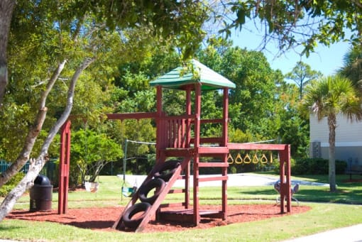 Outdoor Playground equipped with a slide, monkey bars, and ladder