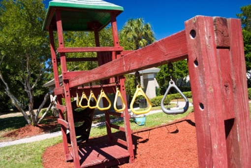 Outdoor Playground equipped with a slide, monkey bars, and ladder