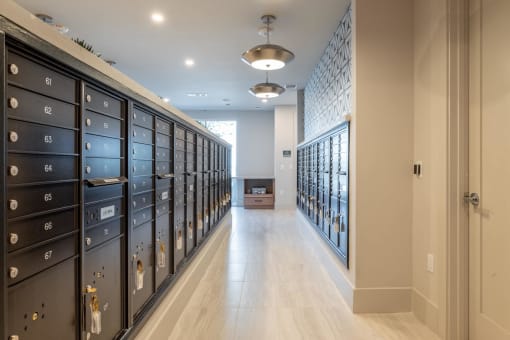 a long hallway with many lockers in a room