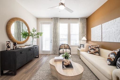 a living room with a white couch and a coffee table