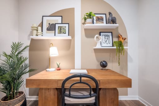 a home office with a wooden desk and a chair
