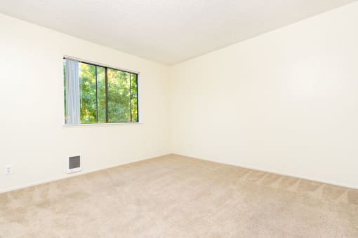 an empty room with a window in it