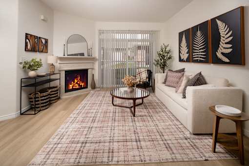 A living room with a fireplace and a couch.