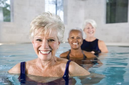 three older women in a swimming pool