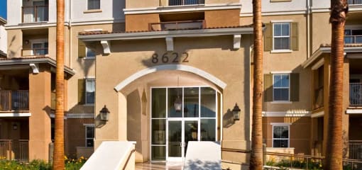 an apartment building with a door and the address of 6832