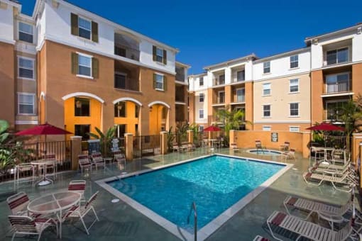a swimming pool in the middle of an apartment building
