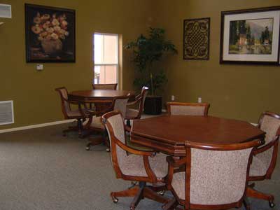 a dining room with a wooden table and chairs