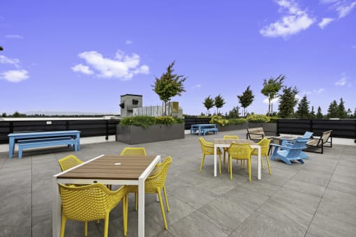Resident rooftop terraces with tables and chairs at Arabella Apartment Homes, Shoreline, Washington 98155