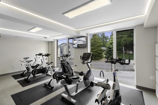 Resident Fitness Facilities filled with exercise equipment at Arabella Apartment Homes, Shoreline, 98155