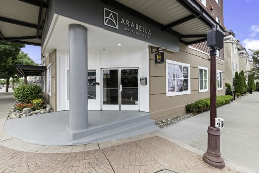 View of the property entrance with Property Signage at Arabella Apartment Homes, Shoreline, WA