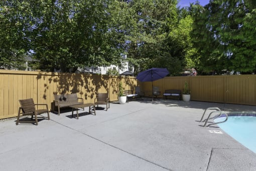 Pool and Lounge Area with Patio Furniture at Casa Blanca Apartment Homes, Washington, 98204