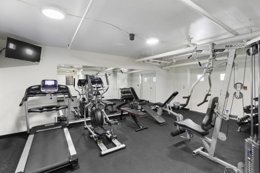 Fitness Facilities complete with various exercise equipment and television at King Arthurs Court, Seattle, WA, 98125