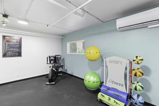 Fitness Facility with weighted wall balls, stationary bike, and more at King Arthurs Court, Seattle, Washington