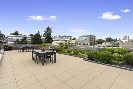 Resident Lounge on the Rooftop with a dining table and chairs at Villaggio Apartment Homes, Tacoma