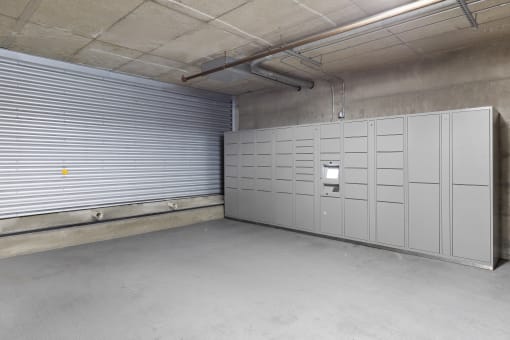 a row of package lockers in a storage facility at Villaggio Apartment Homes, Tacoma, 98402